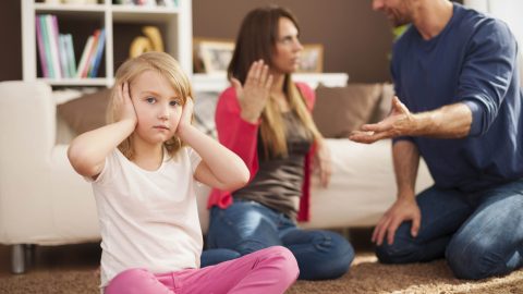 Little girl doesn't want to hear arguing of parents