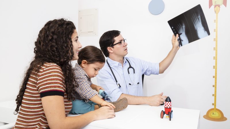 side-view-doctor-holding-radiography